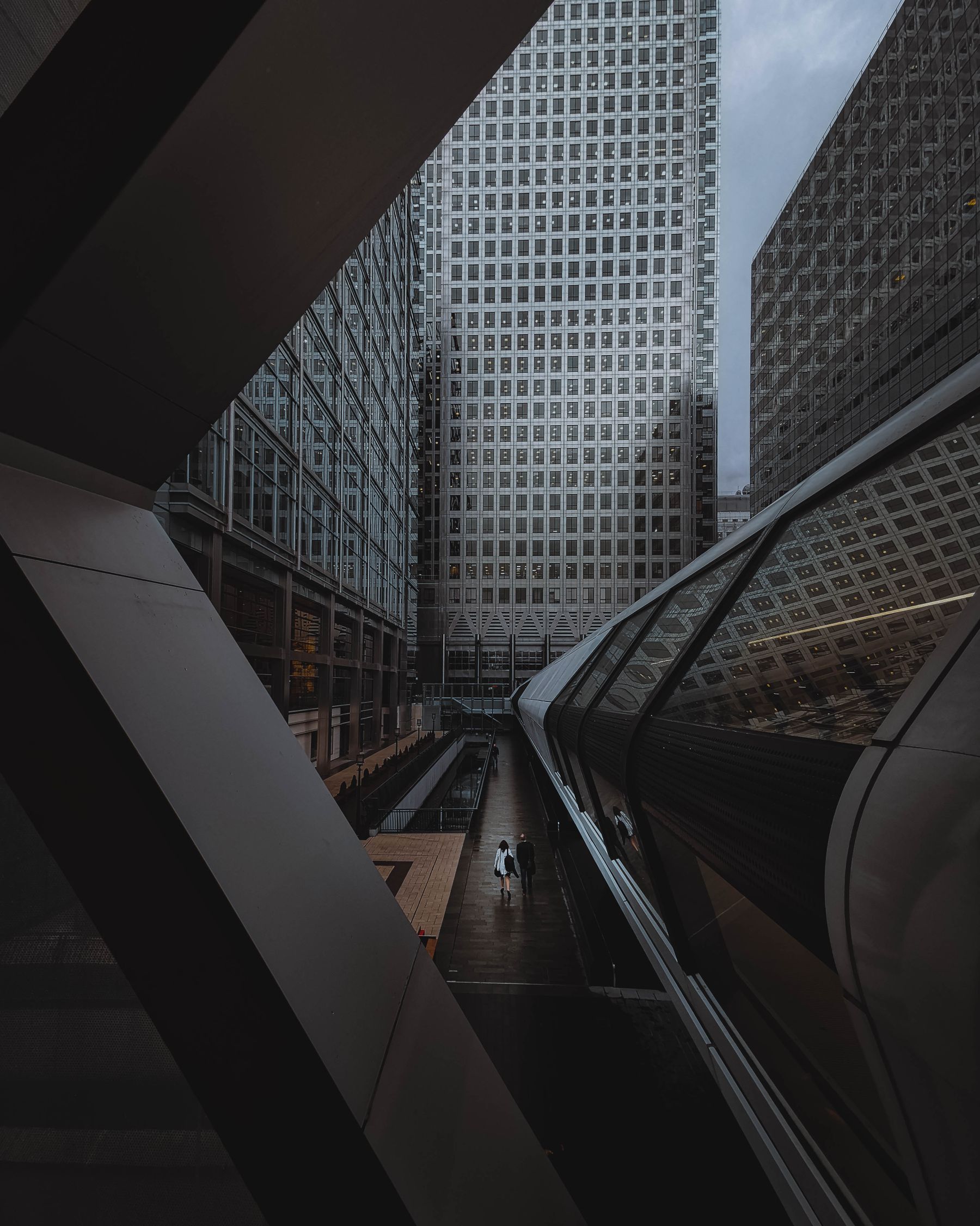 People moving through a modern global financial district